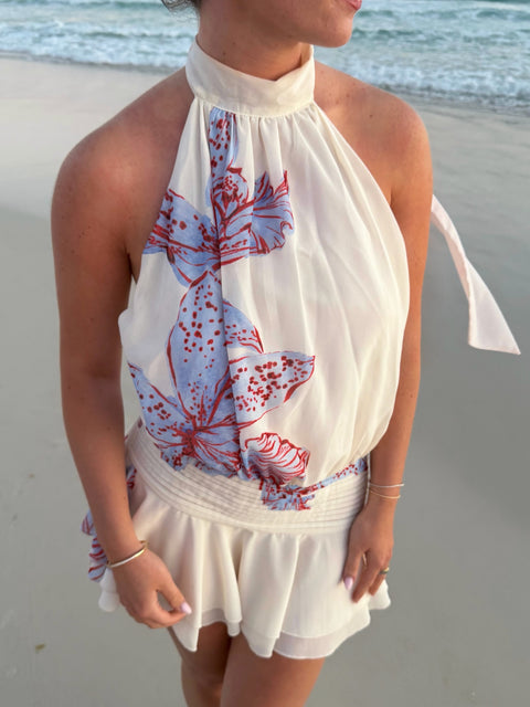 Cremefarbenes kurzes Neckholder-Kleid mit Blumenmuster und tiefsitzender Taille