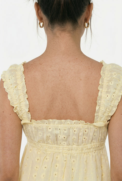Hellgelbes Minikleid mit Lochstickerei, Rüschen und Spaghettiträgern