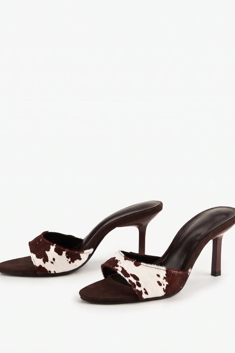 Mules à talons aiguilles imprimé vache
