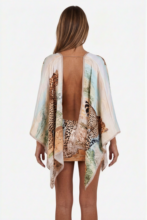 Abito da resort con scollo a V profondo e stampa leopardata paesaggistica