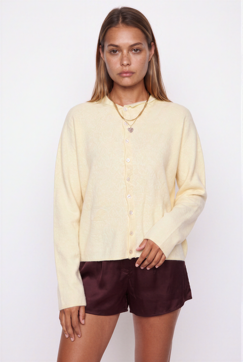 Soft pink button-up knit cardigan