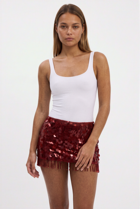 Gonna rossa con paillettes e frange di perline